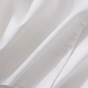 Close-up of the white sheet set